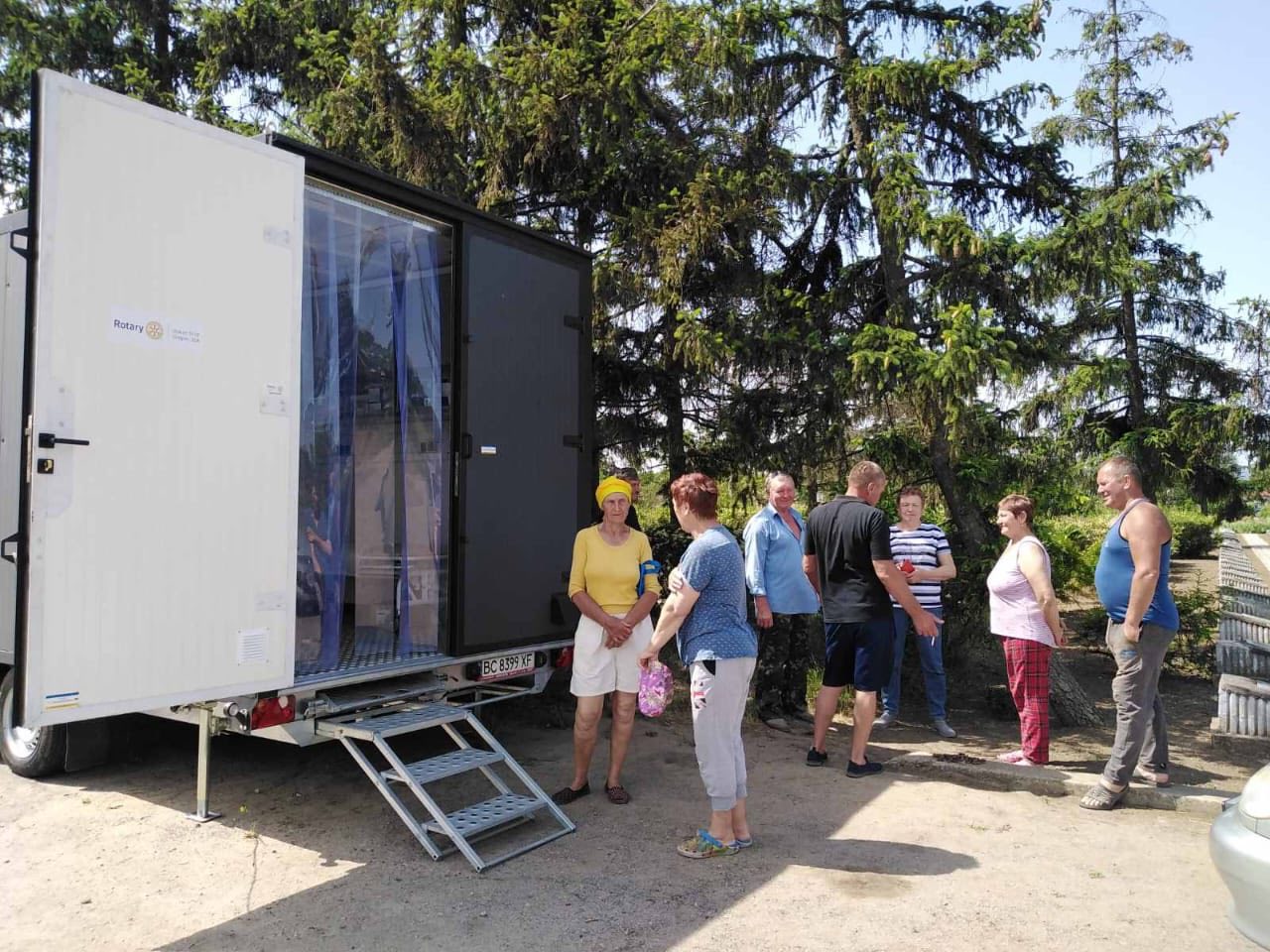 Patients are in line to get the support at a mobile clinic in Ukraine