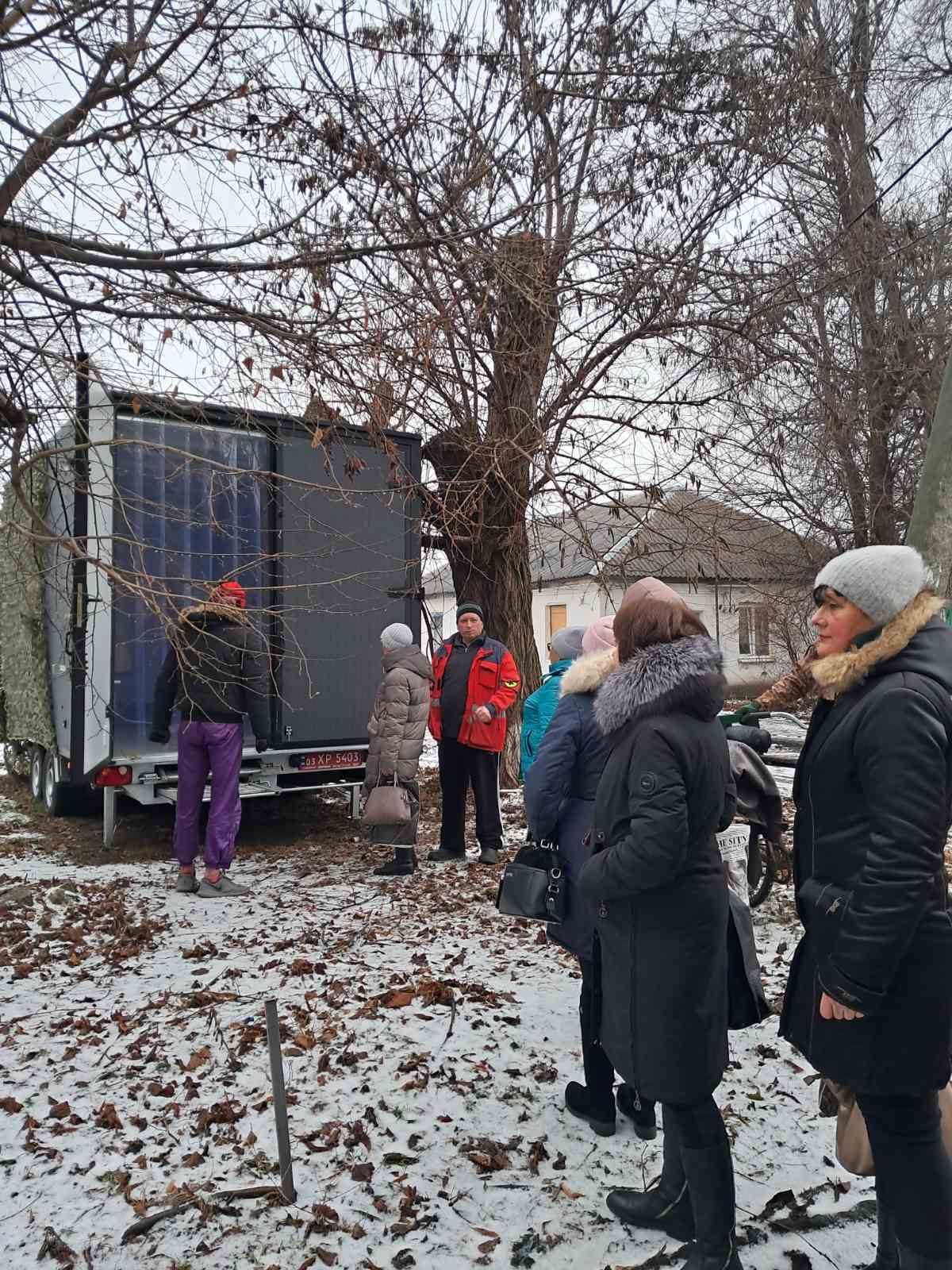 Patients are in line to get the support at a mobile clinic in Ukraine